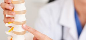 chiropractor-demonstrating-spine-problem